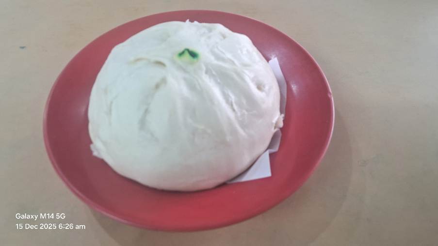 A round white ball on a red plate

AI-generated content may be incorrect.